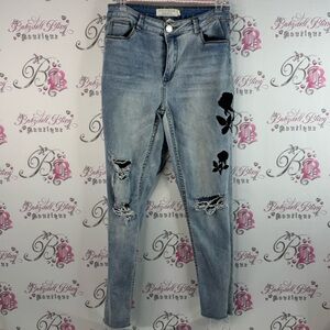 Streetwear society pants Light Blue Distressed Jeans with Black Floral Details